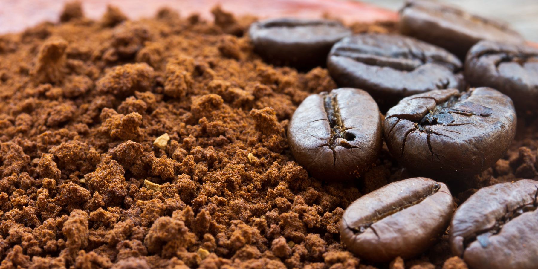 Close-up of coffee beans and ground coffee